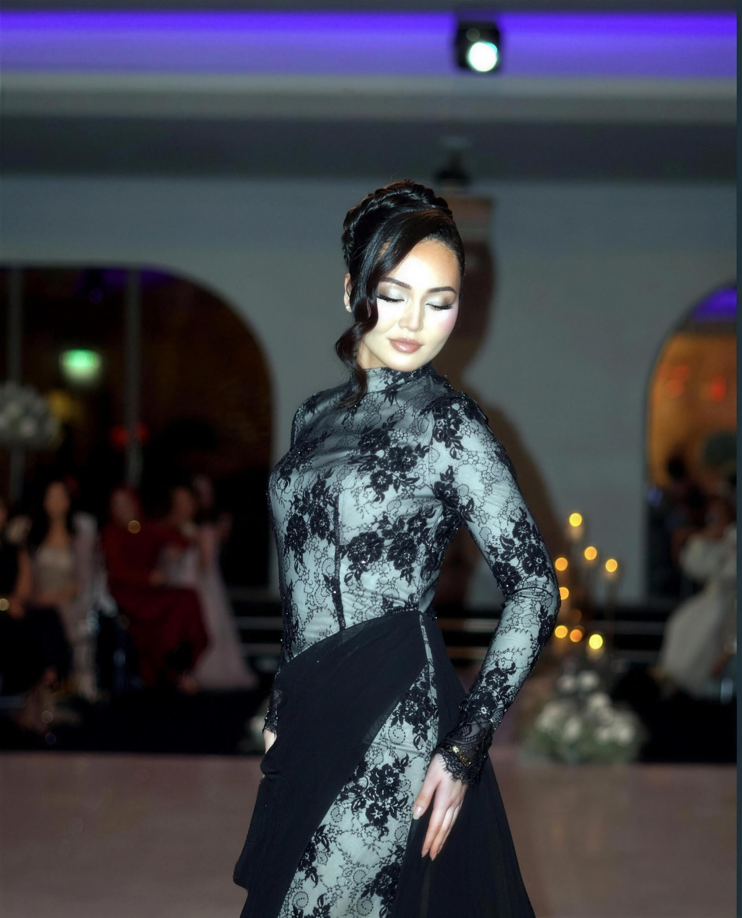 A model in a black-lace modest couture gown — RAIÉ Couture editorial