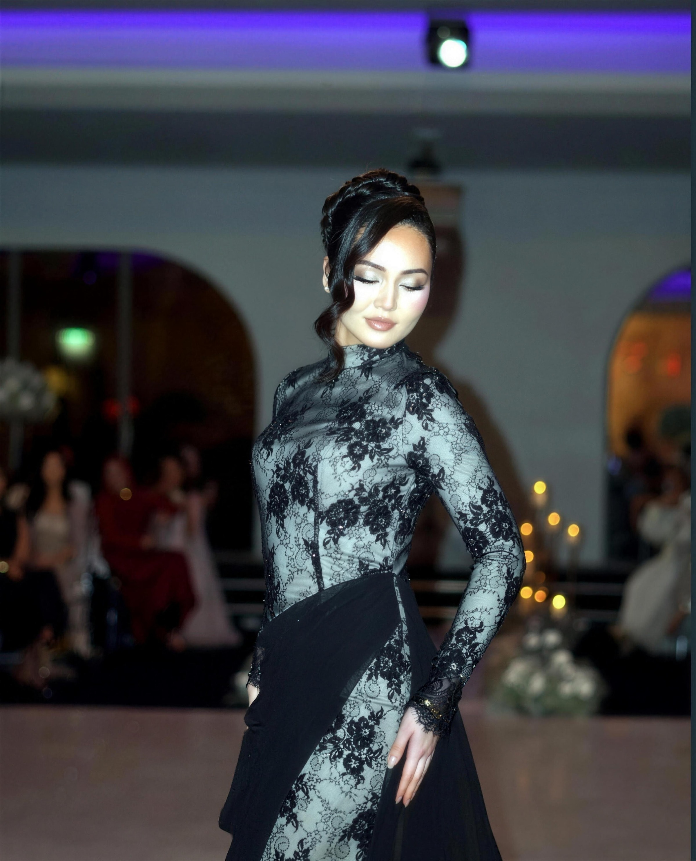 A model in a black-lace modest couture gown — RAIÉ Couture editorial