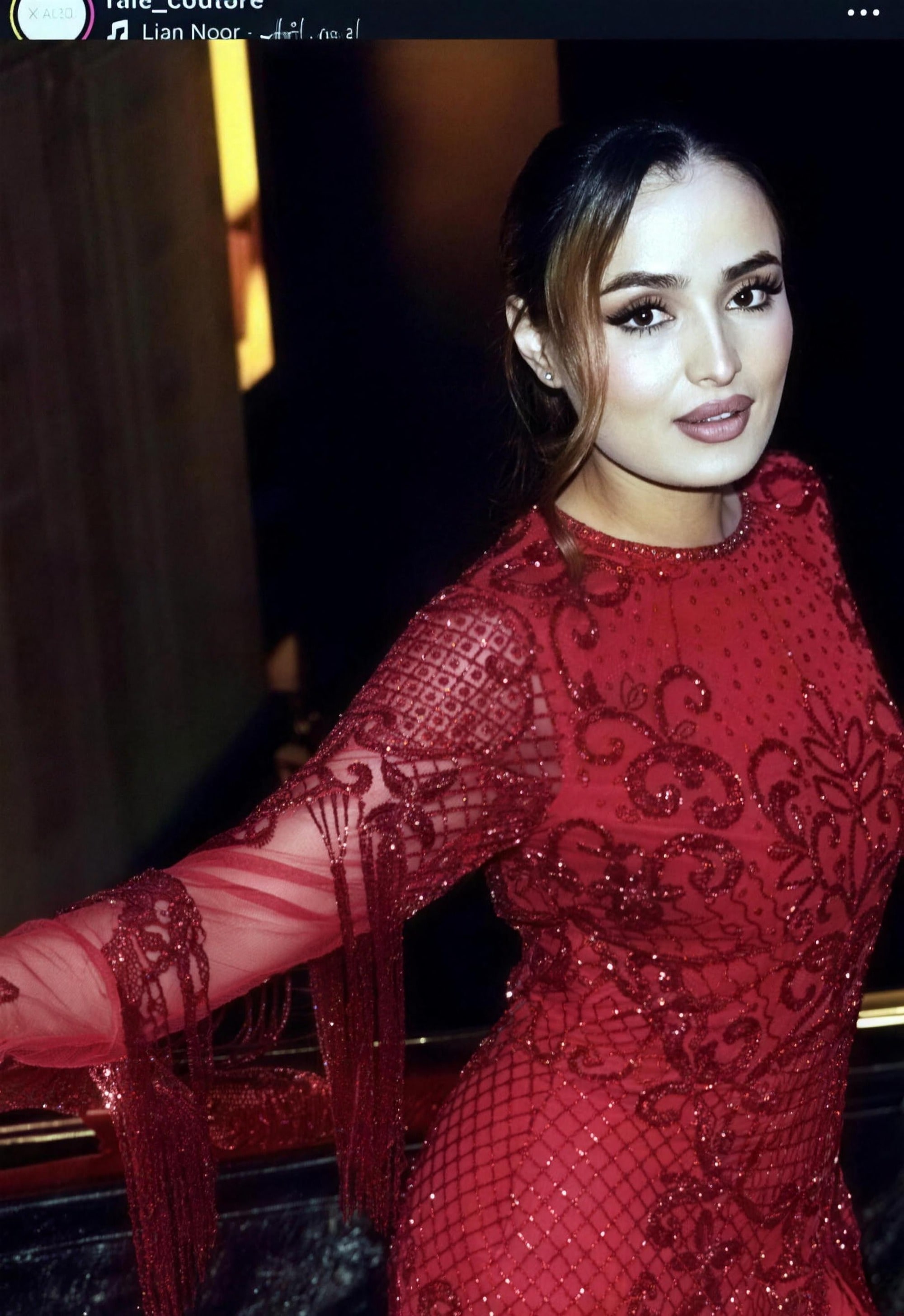 Deep-red beaded modest evening gown by RAIÉ Couture