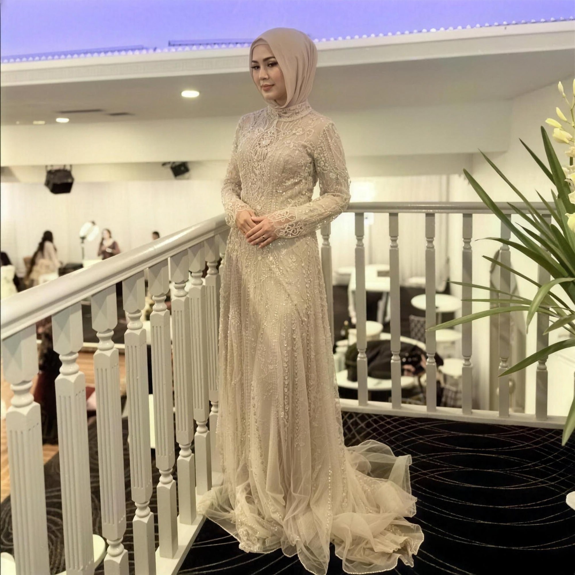 Champagne beaded modest evening gown by RAIÉ Couture