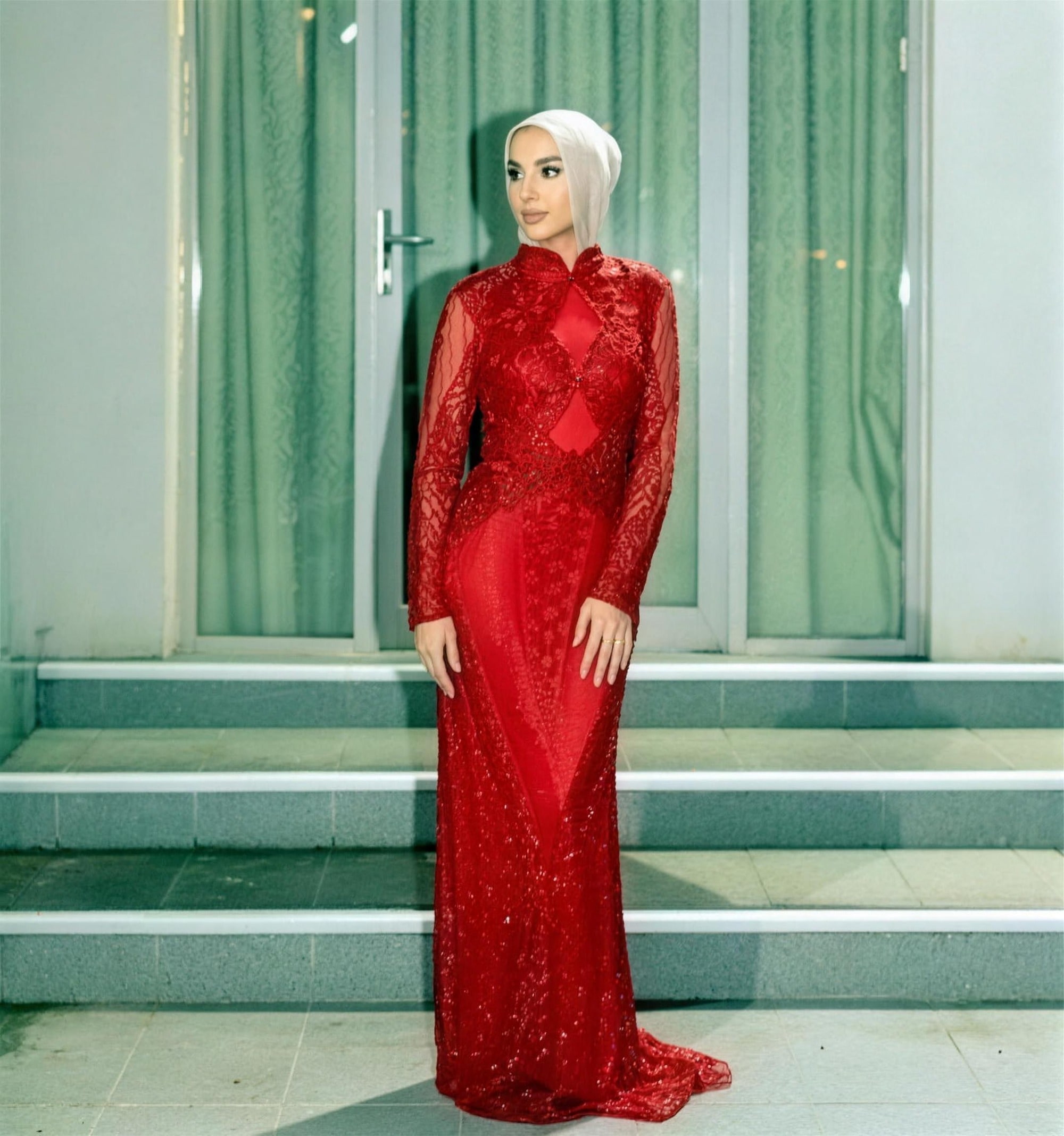 Deep-red beaded modest evening gown by RAIÉ Couture