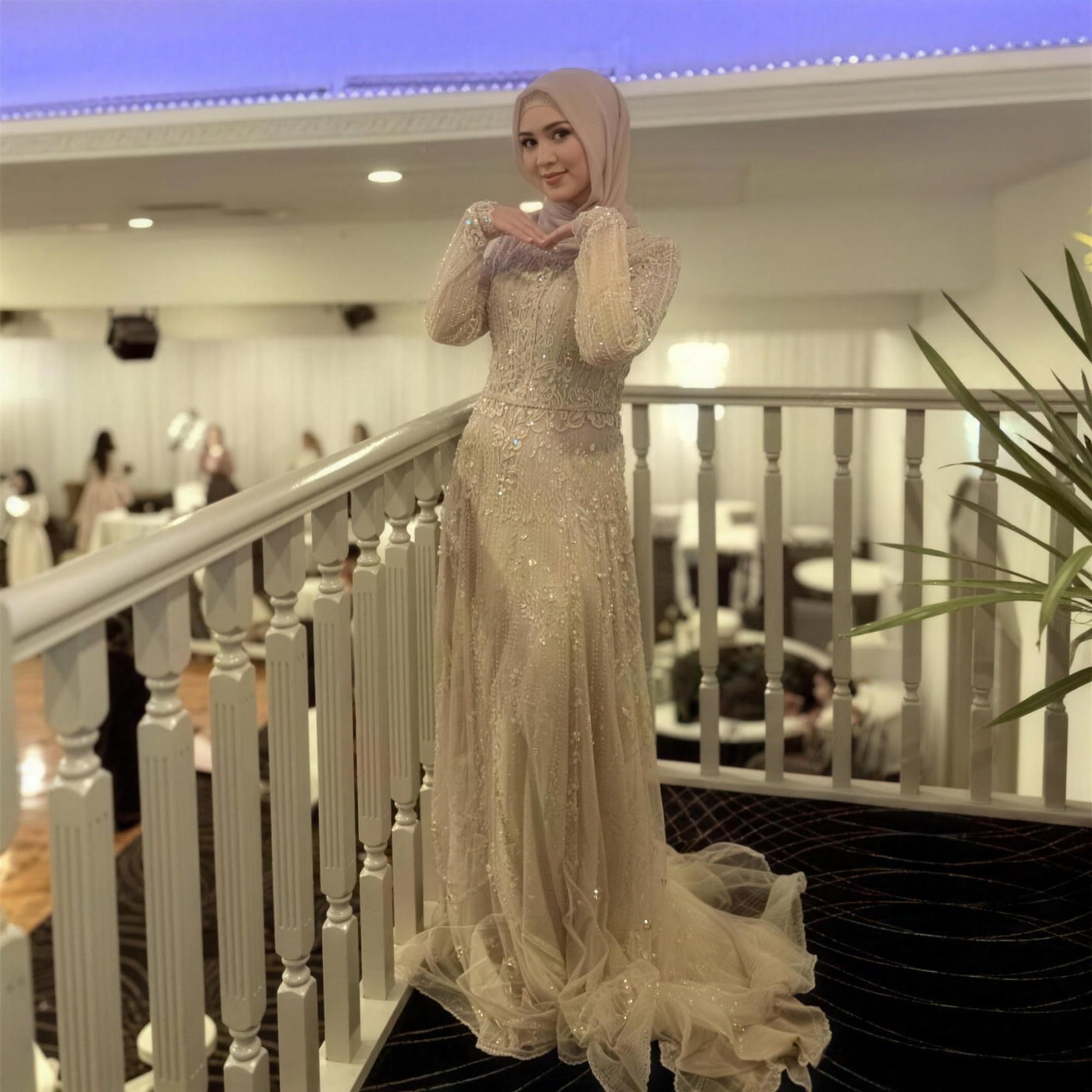 Champagne beaded modest evening gown by RAIÉ Couture